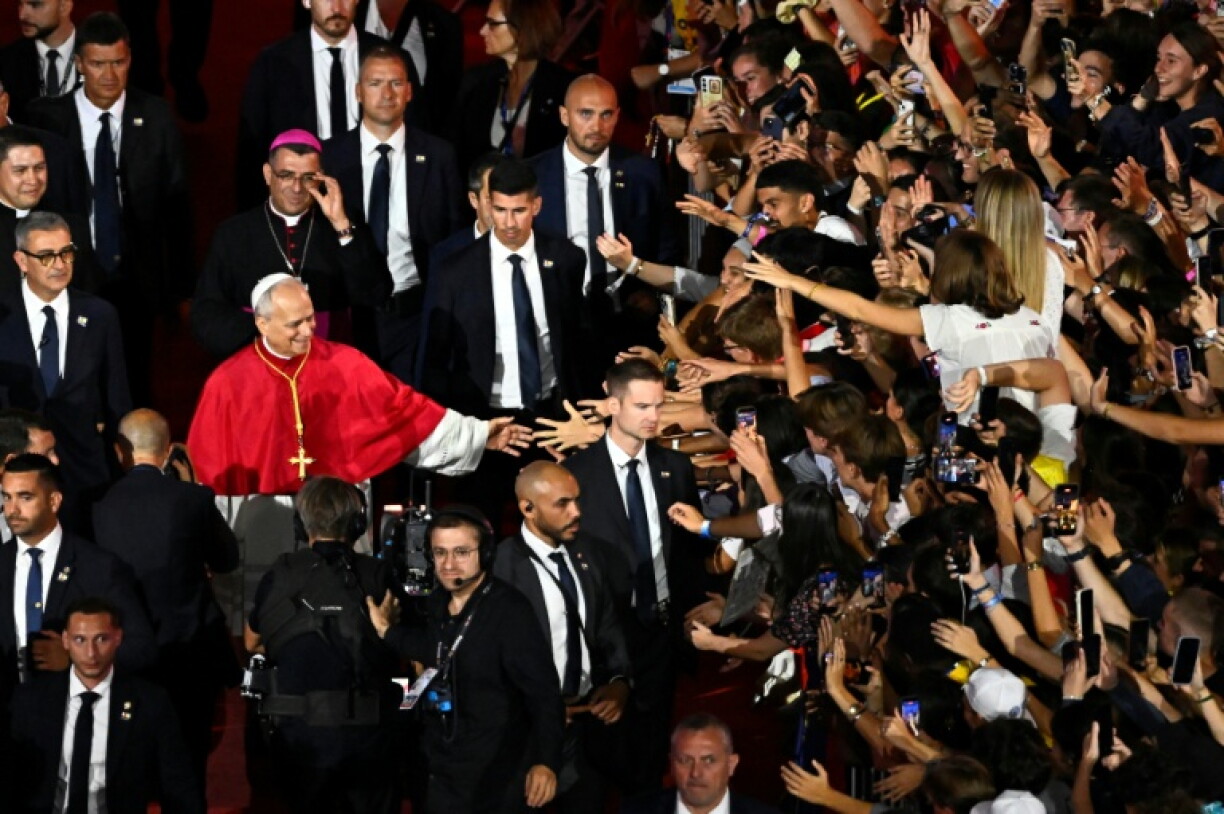 Pope Leo greets the crowd in Saint-Denis