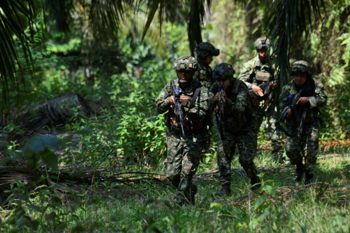 Army soldiers patrol in Tibu, Norte de Santander province, Colombia, on January 21, 2025, after recent clashes between rival left-wing guerrillas.