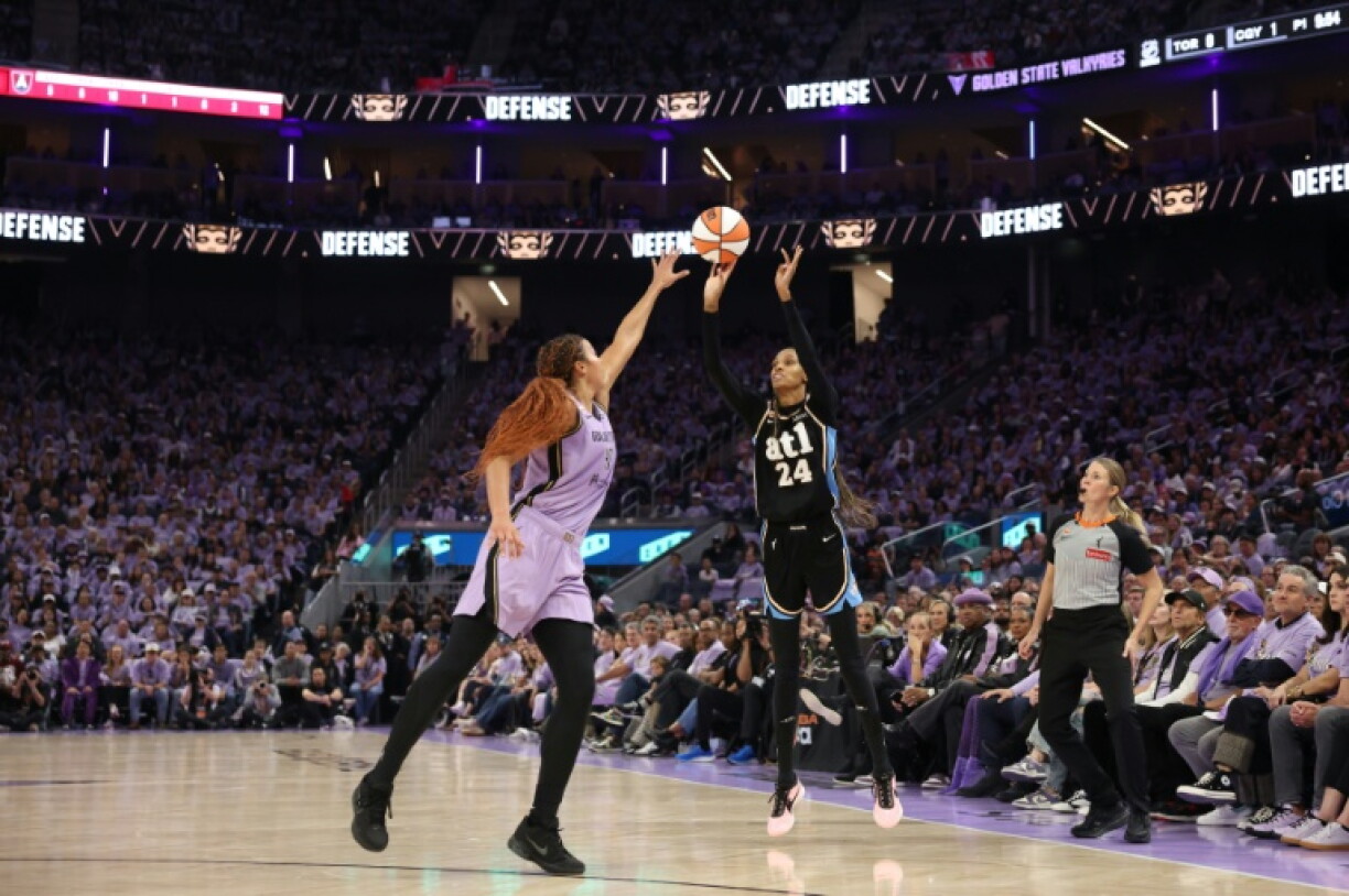 Golden State's Kiah Stokes, center, defends against Atlanta's DeWanna Bonner as the Valkyries beat Atlanta to move within one victory of capturing the WNBA Finals