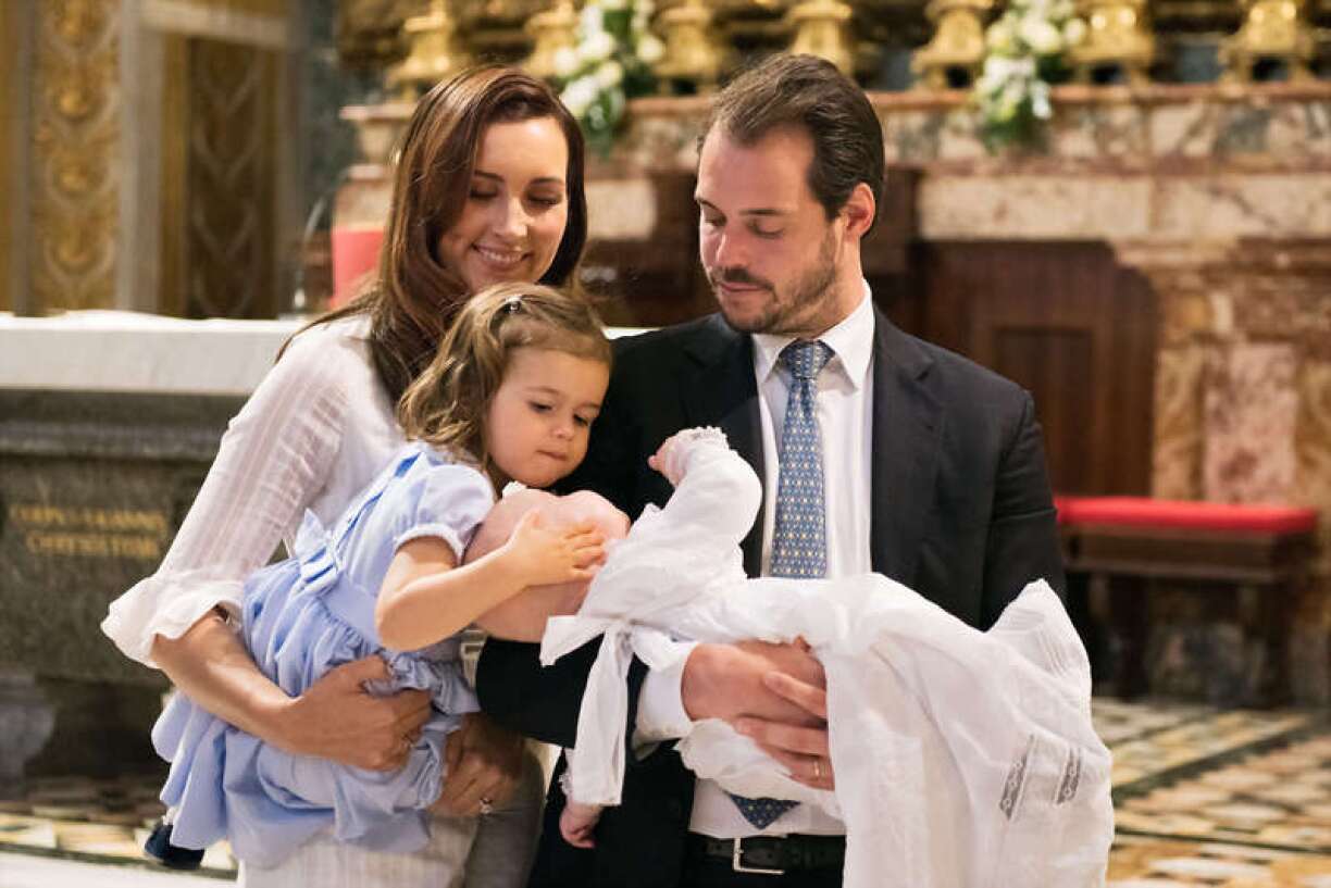 Prince Félix with his wife Princess Claire and his daughter Princess Amalia at young Prince Liam's baptism in the Vatican.
