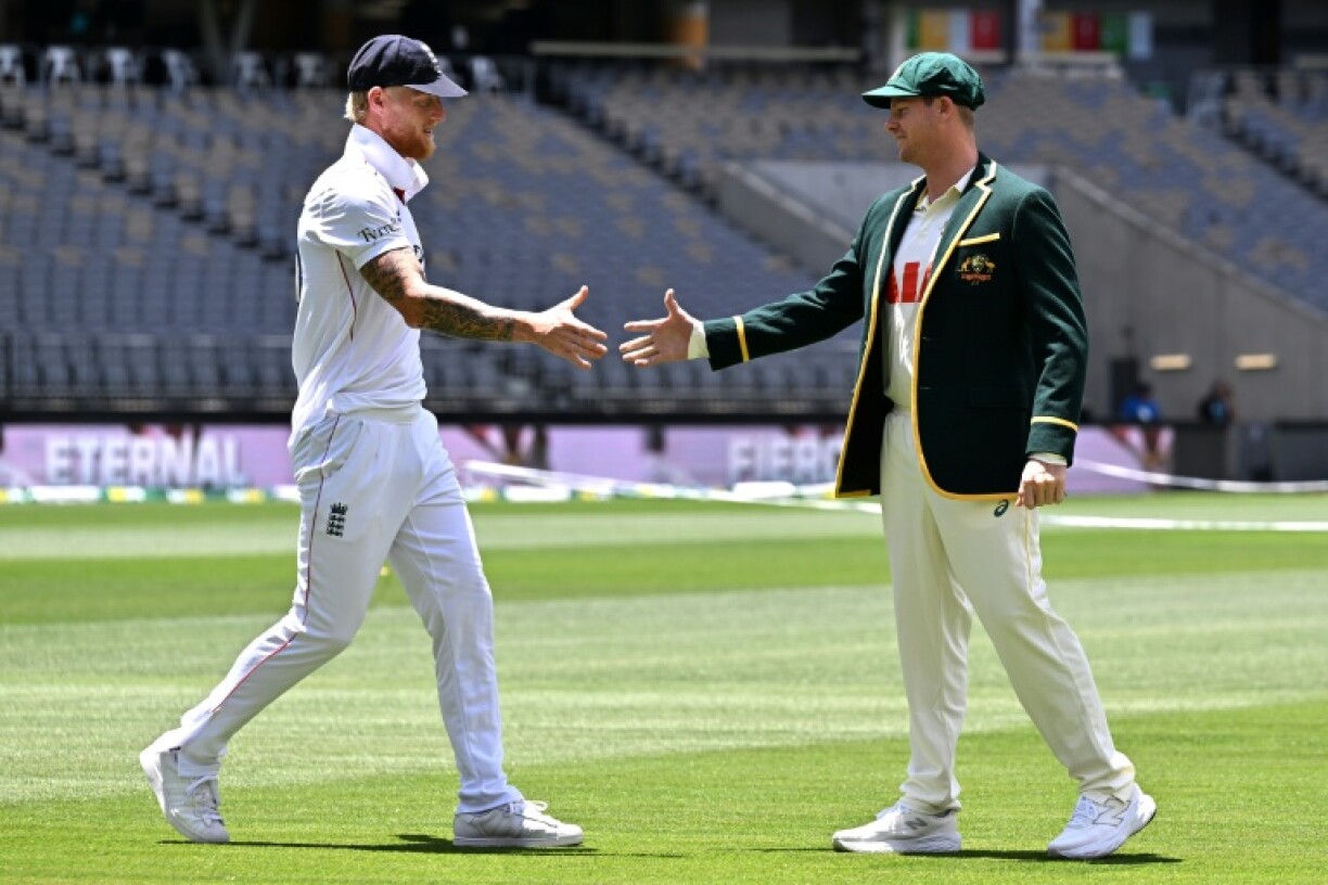 Australia captain Steve Smith (R) shakes hands with England captain Ben Stokes at Perth Stadium