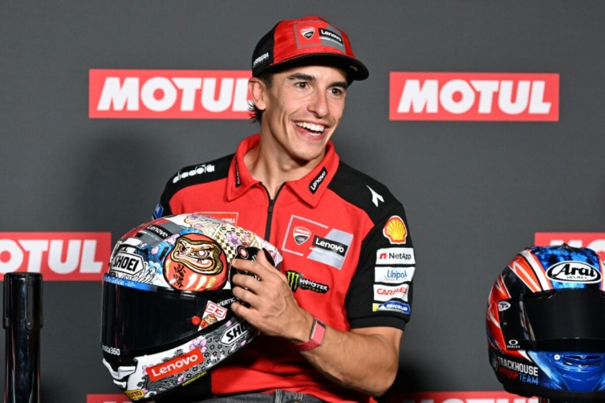 Ducati Lenovo Team rider Marc Marquez of Spain shows his helmet during a press conference ahead of the September 28 Japanese MotoGP Grand Prix at Mobility Resort Motegi in Motegi, Tochigi prefecture on September 25, 2025