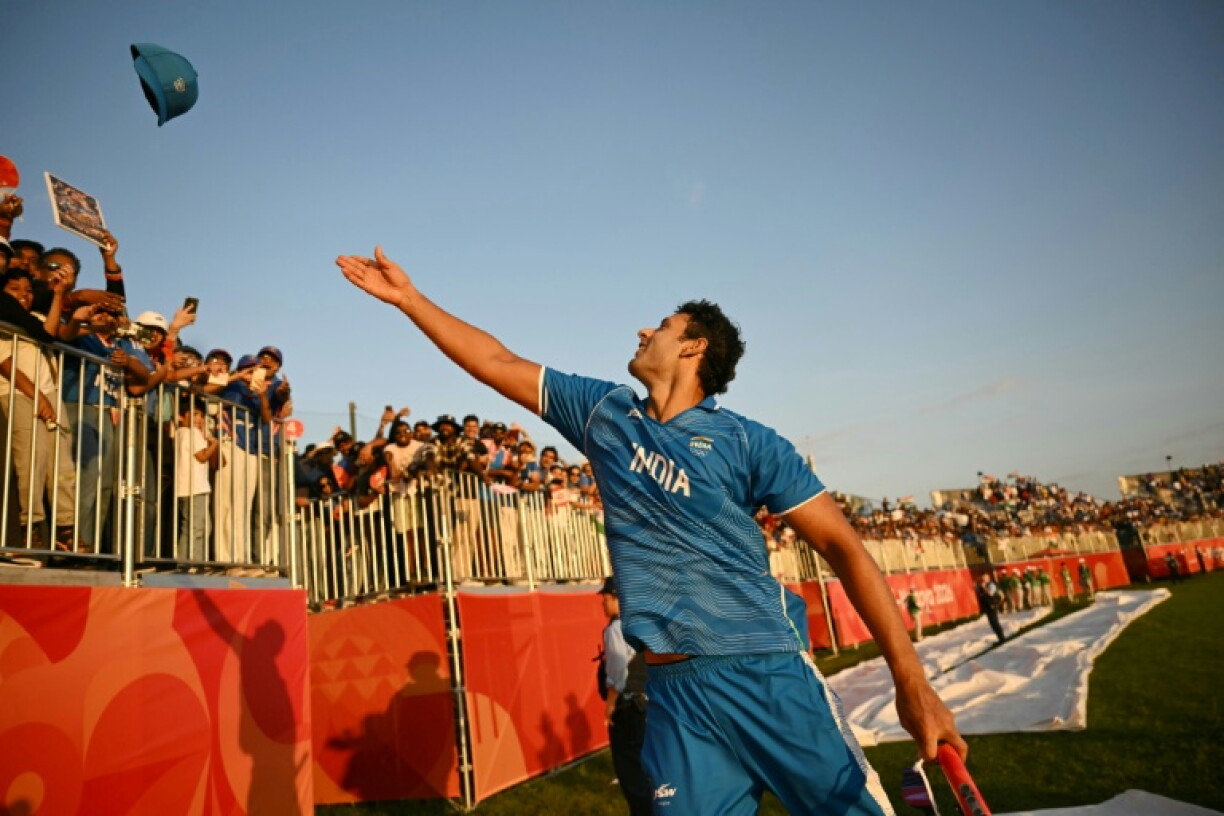 India's Shivam Dube throw his hat into the crowd