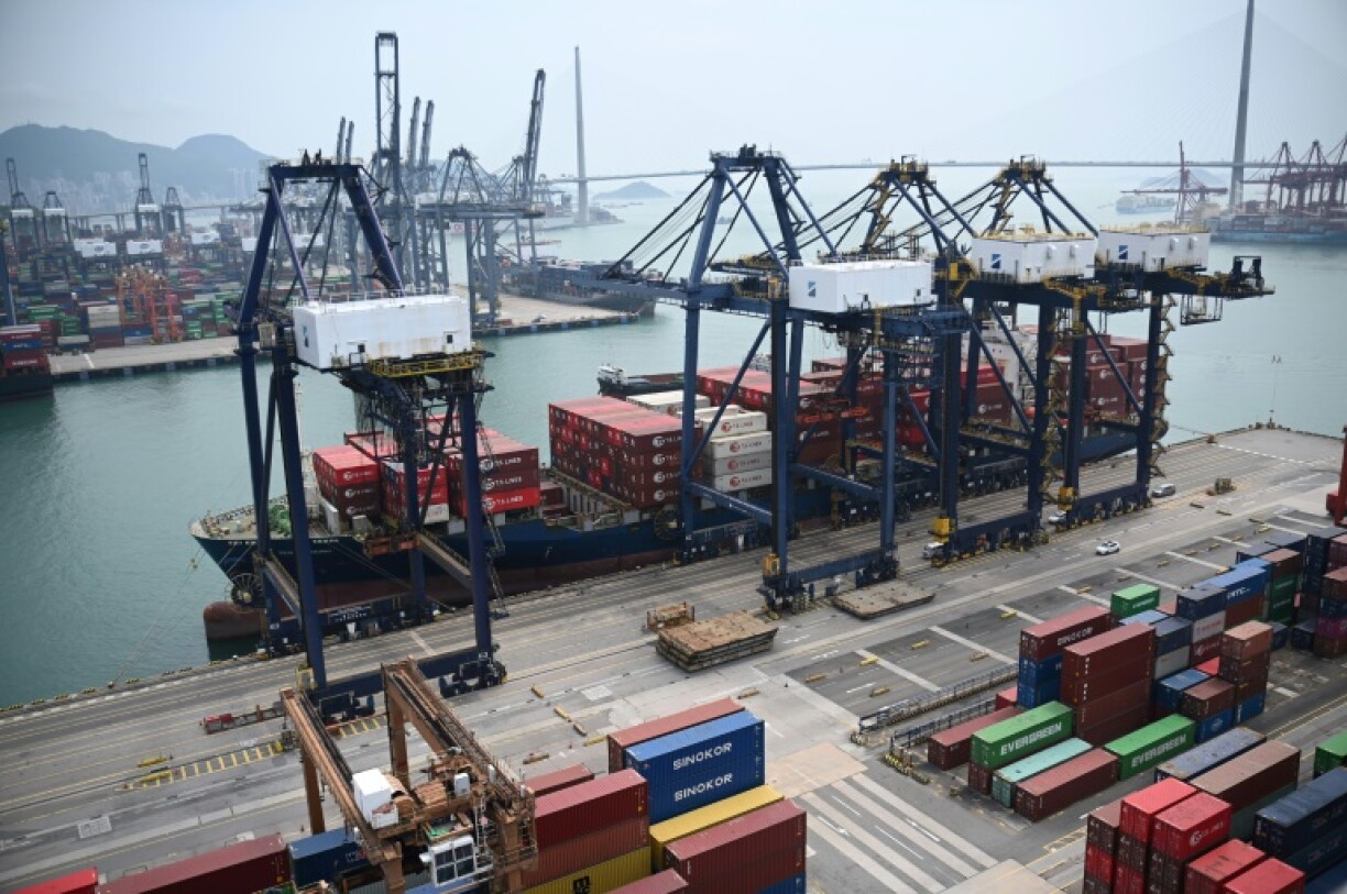 A container ship unloads its cargo at Kwai Chung Container terminal in Hong Kong