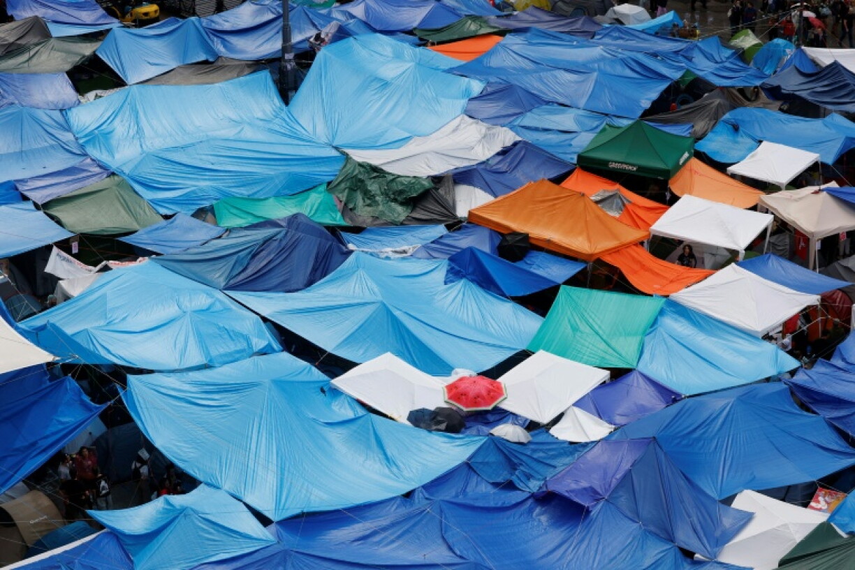 Hundreds of protesters are occupying a tent city in central Madrid to press for reforms