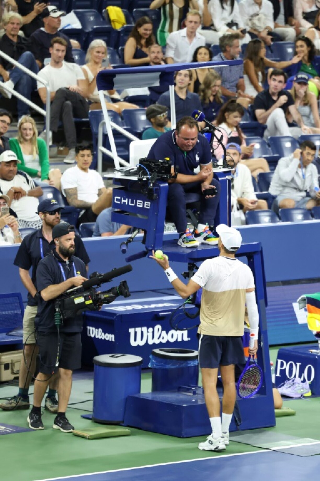 France's Benjamin Bonzi complains to the umpire over the spectator noise during his stormy victory over Daniil Medvedev