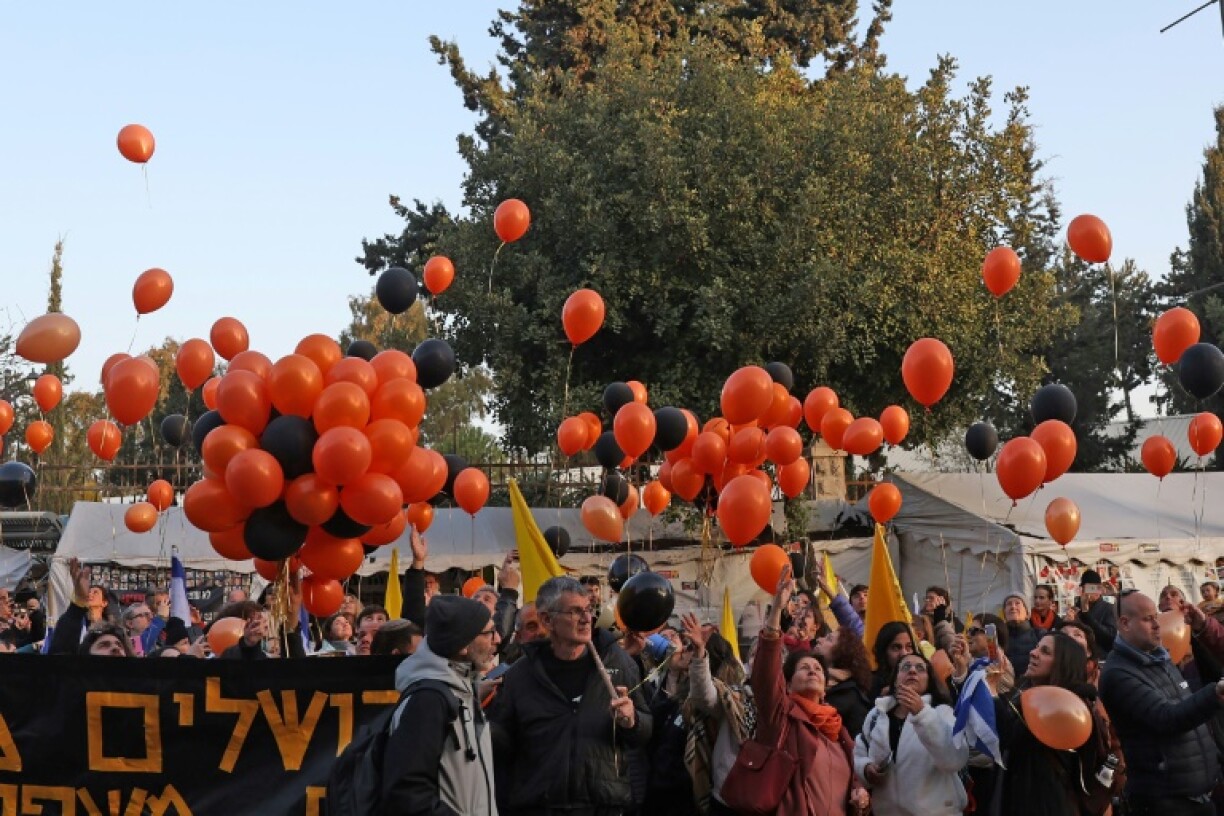 People gather near the residence of the Israeli prime minister in Jerusalem to pay their respects to hostages killed in captivity