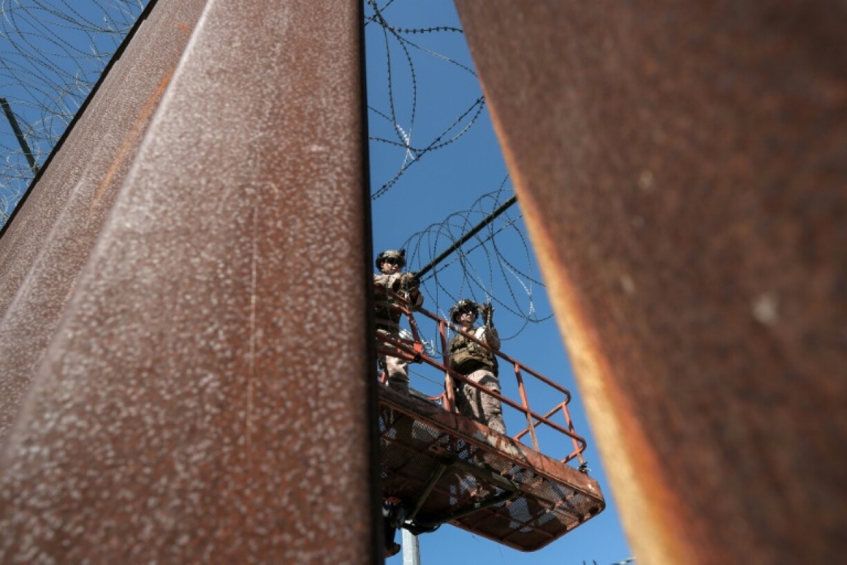 US Marines have also been strengthening the border fence with barbed wire