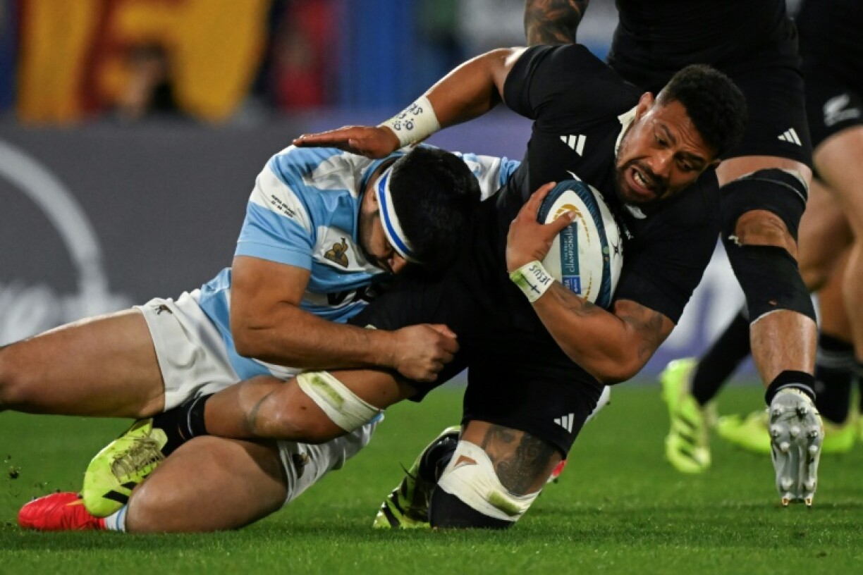 New Zealand's number 8 Ardie Savea is tackled by Argentina's Los Pumas prop Nahuel Tetaz Chaparro
