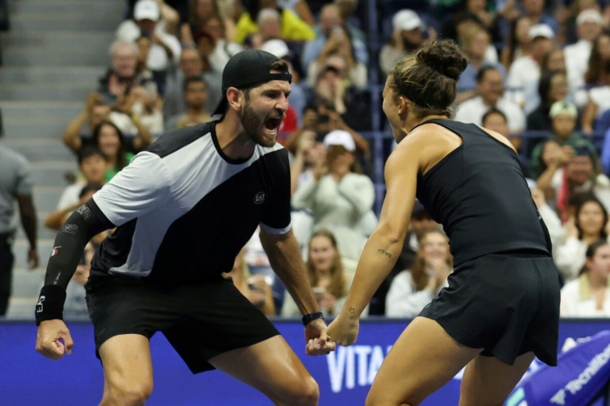 Italy's Andrea Vavassori and Sara Errani celebrate after beating Iga Swiatek and Casper Ruud in the US Open mixed doubles final