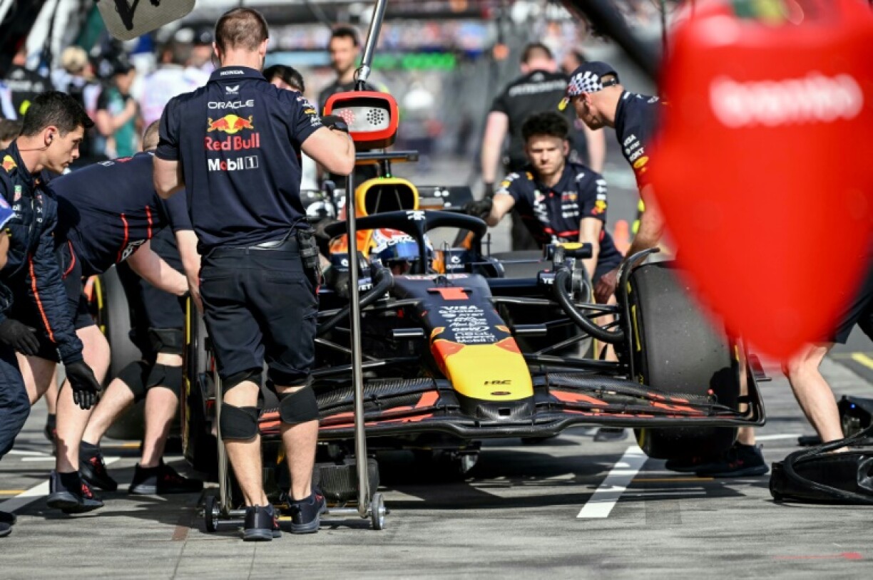 Mechanics work on the car of Red Bul's Dutch driver Max Verstappen in Australia