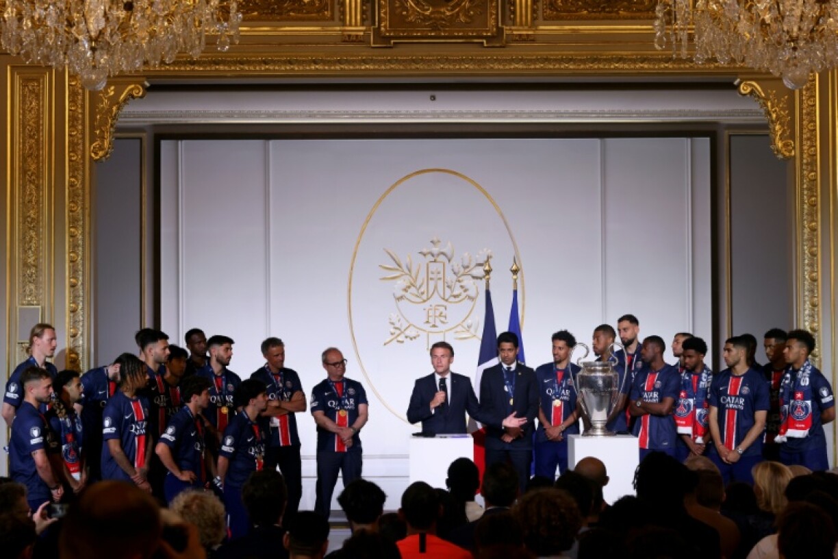 President Emmanuel Macron welcomes Paris Saint-Germain players and coaches at the Elysee Palace on Sunday