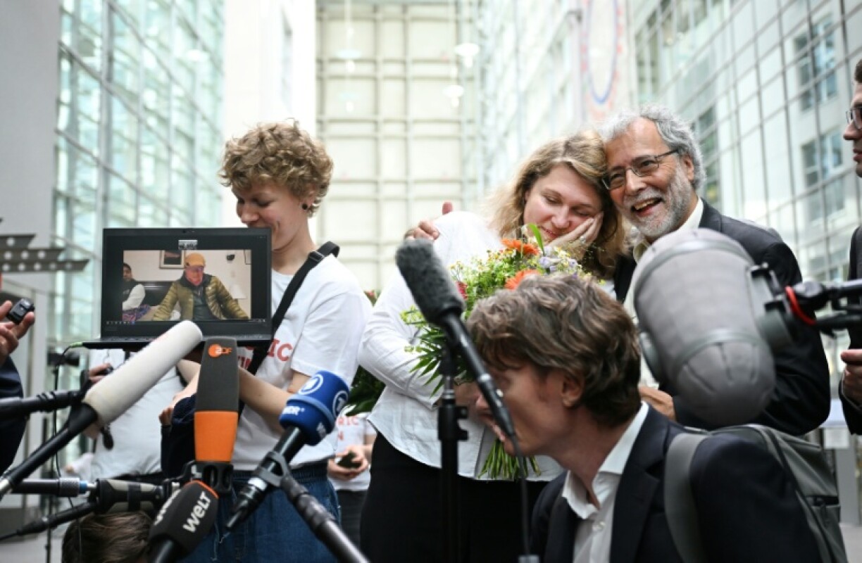 The ruling was a 'milestone' for climate litigation, Peruvian farmer Saul Luciano Lliuya's lawyer Roda Verheyen (C) said in a statement