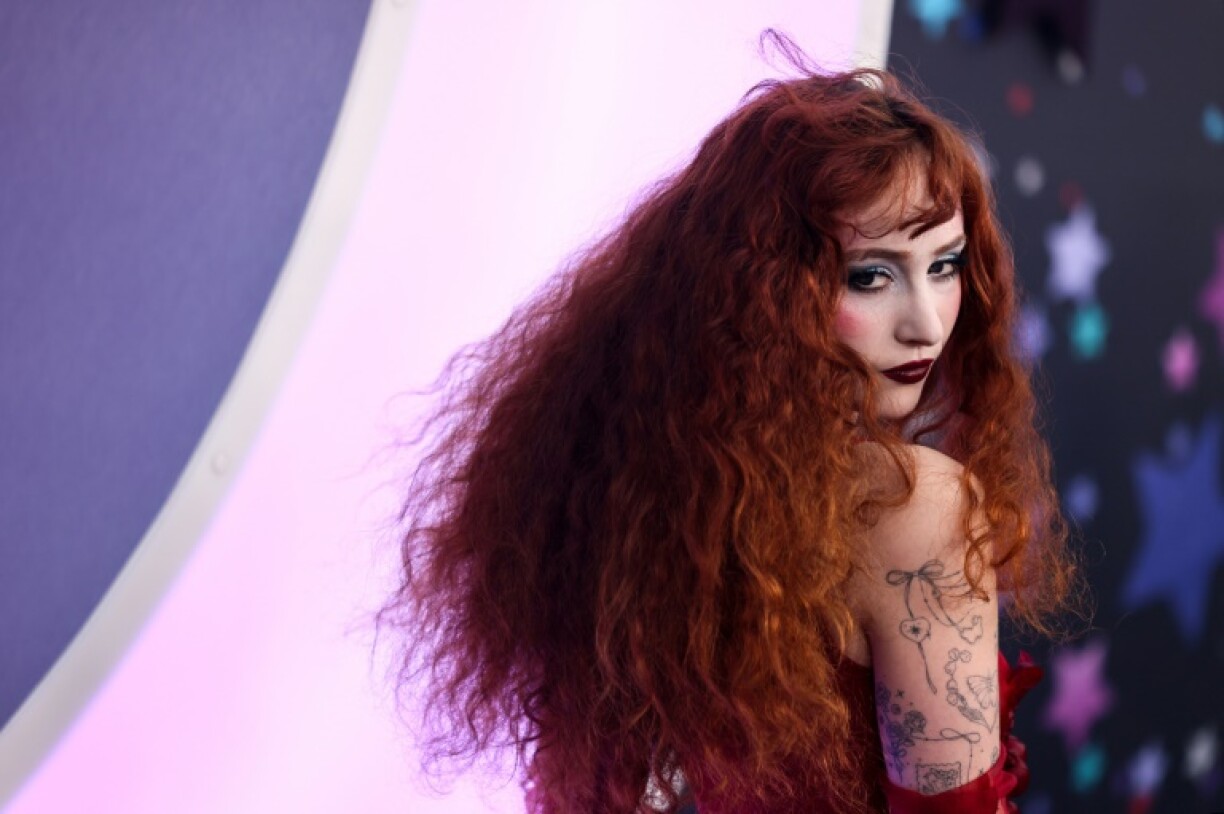 Chappell Roan's songs delve into themes of sexuality and yearning with a pop-forward, dance-heavy beat, and impressive vocals that one critic characterized as 'singing in cursive'