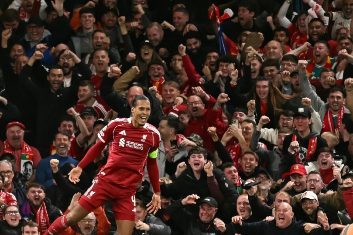 Liverpool defender Virgil van Dijk celebrates his late winner against Atletico Madrid