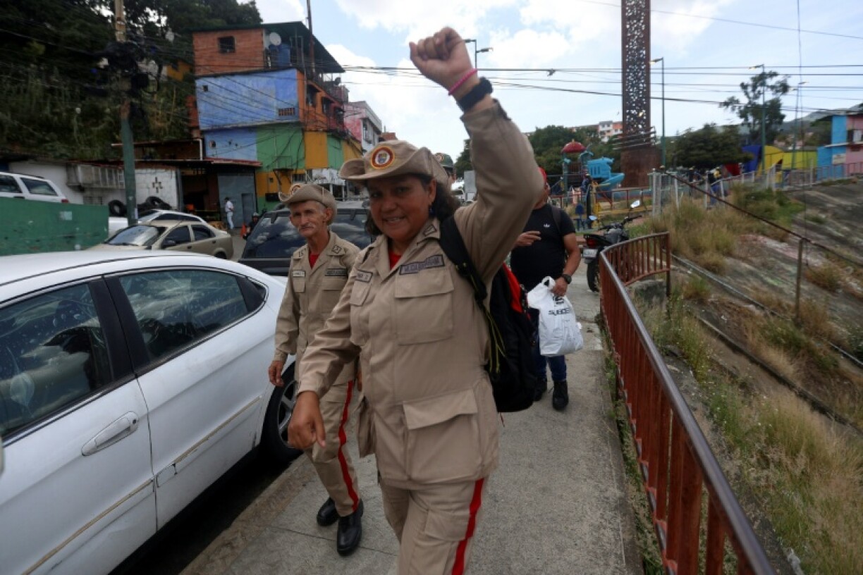 A member of the presidential guard salutes during an orientation day for people who signed up for the Bolivarian Militia