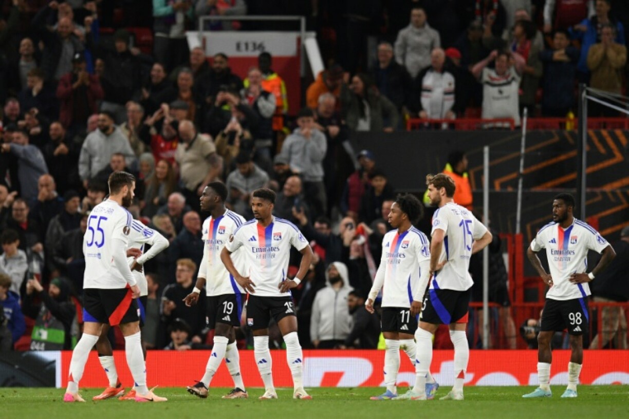Lyon players are left stunned at full-time following their defeat against Manchester United on Thursday