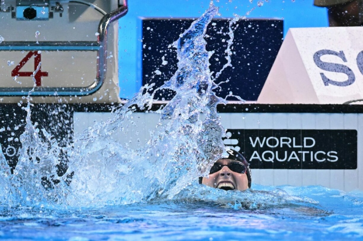 Katie Ledecky celebrates winning the final of the women's 800m freestyle