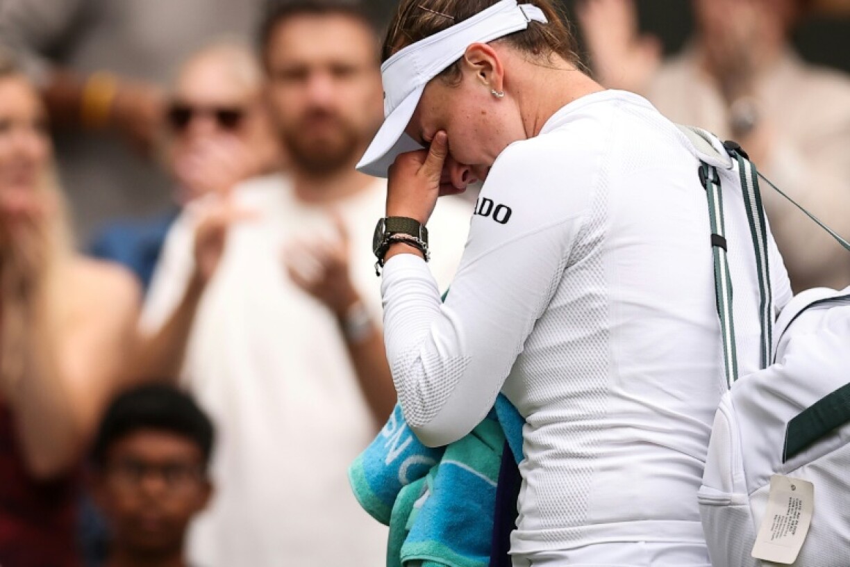Barbora Krejcikova cries as she leaves court following her defeat against Emma Navarro