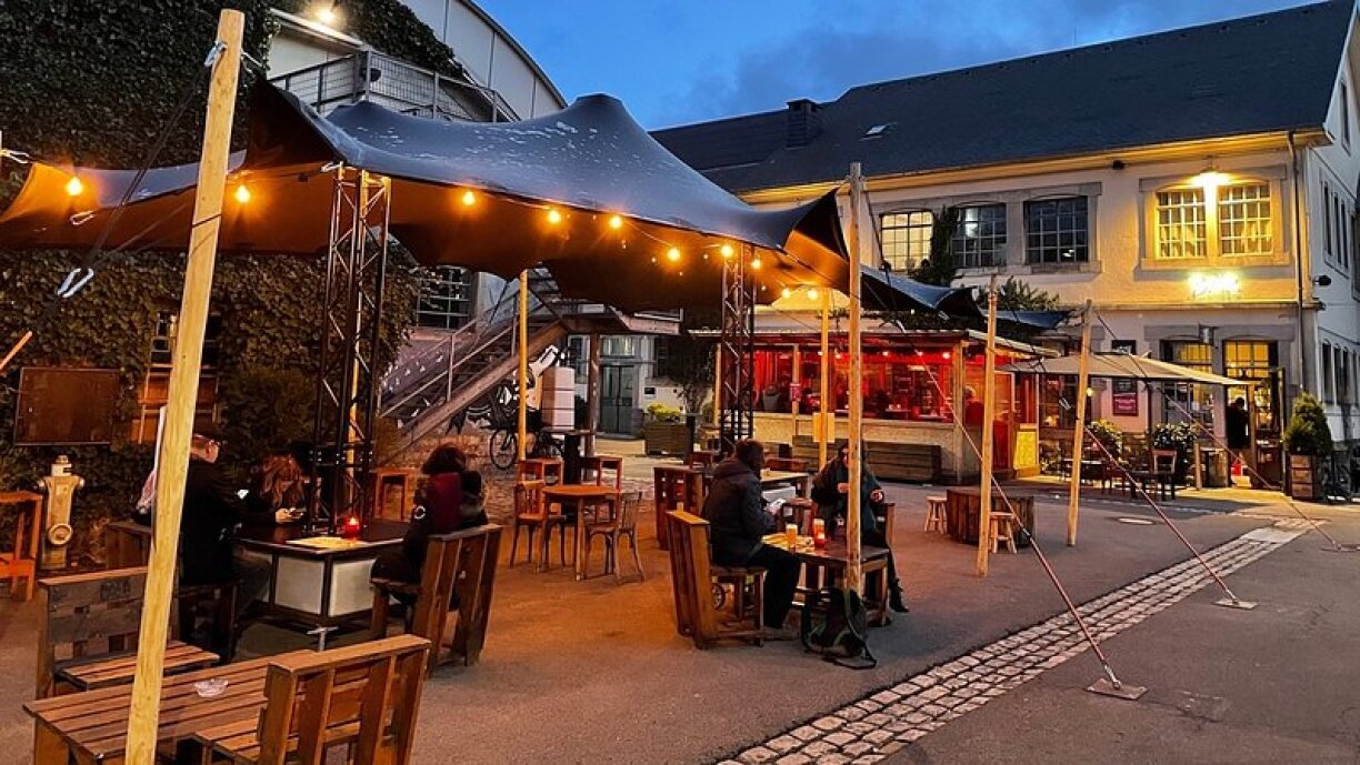 The first customers enjoy the newly-reopened terraces on 7 April.