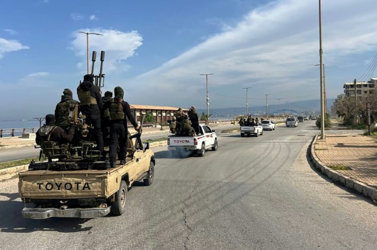 A convoy of troop reinforcements enters the Syrian coastal city of Baniyas after deadly clashes rocked the Mediterranean heartland of ousted president Bashar al-Assad's Alawite minority.