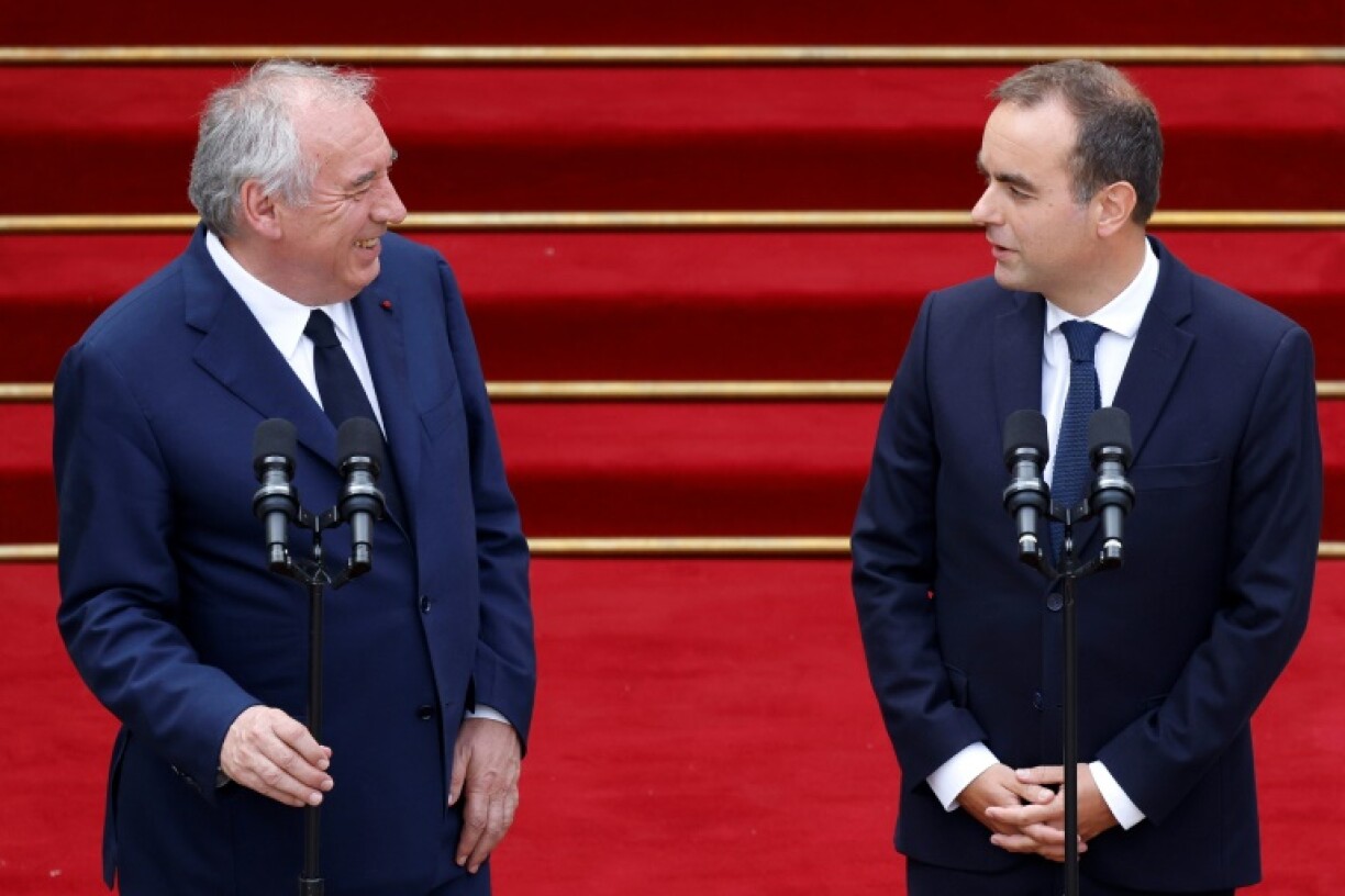 All change: France's outgoing prime minister Francois Bayrou, next to France's newly-appointed Prime Minister Sebastien Lecornu