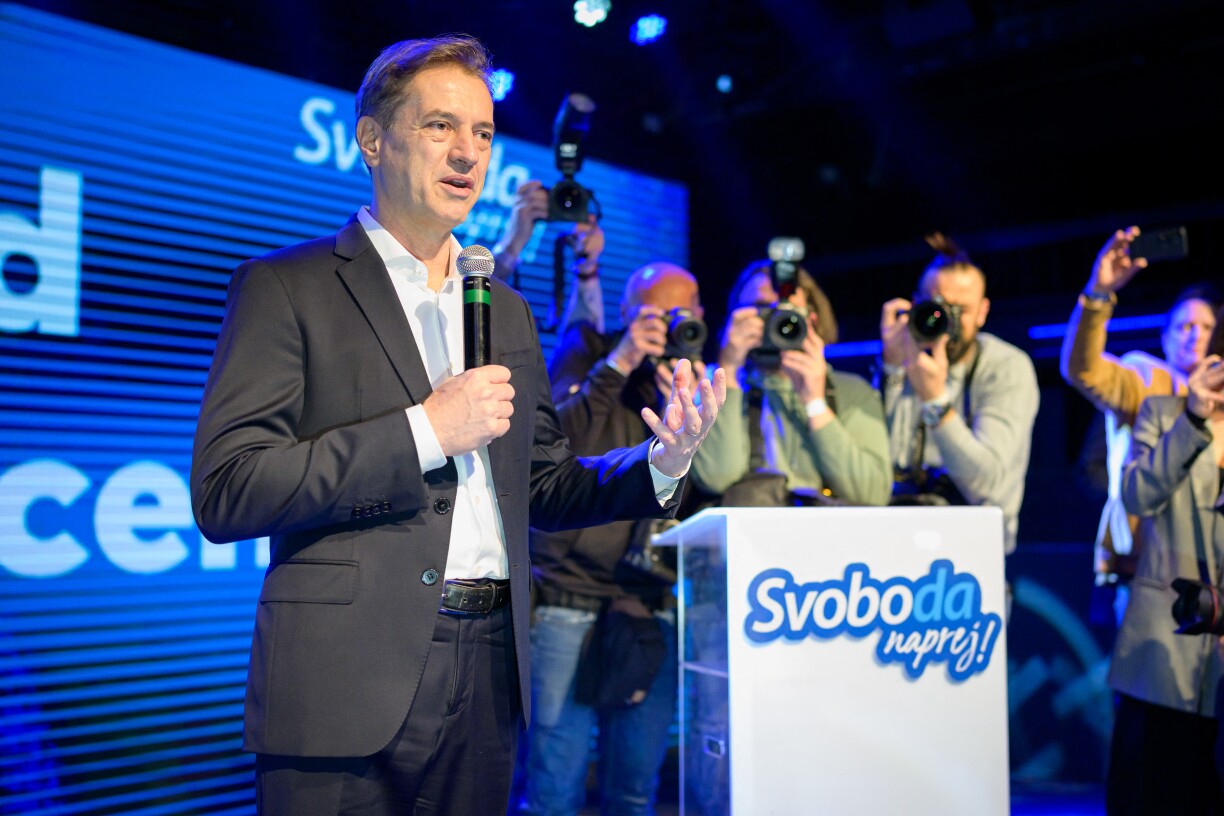 Slovenia's Prime Minister Robert Golob (L) addresses the supporters of Gibanje Svoboda (The Freedom Movement) after the General Elections results are released in Ljubljana, Slovenia, on 22 March 2026.