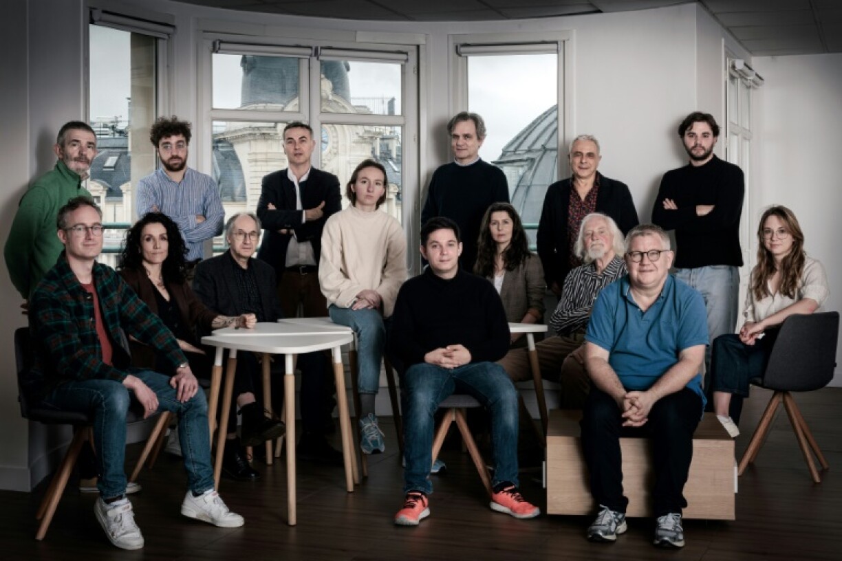 Members of Charlie Hebdo pose during a photo session in Paris in March 2024