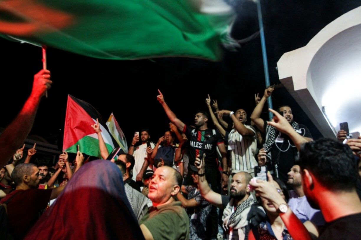 Tunisian protesters at the port of Sidi Bou Said near Tunis on September 9, 2025, after the organisers of a Gaza-bound flotilla said one of their boats was hit by a suspected drone