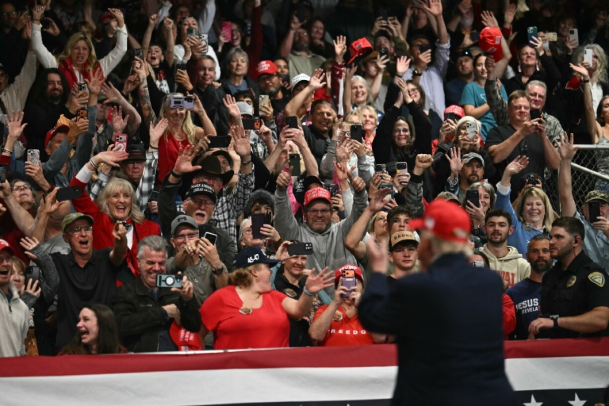 Supporters cheer US President Donald Trump at a rally in Kalispell, Montana, on stop in a campaign tour ahead of November 3 midterm elections