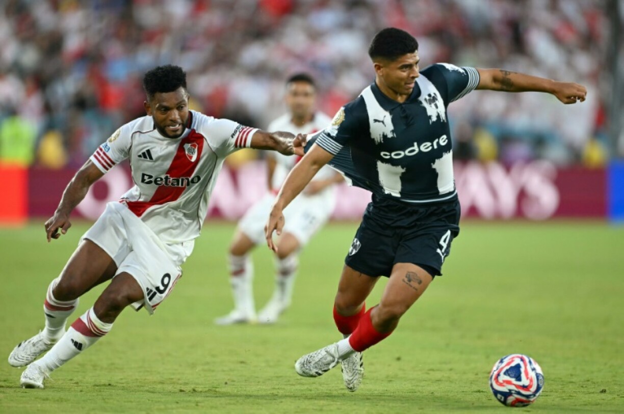River Plate's Colombian forward Miguel Borja and Monterrey's Victor Guzman battle for possession in their Club World Cup stalemate