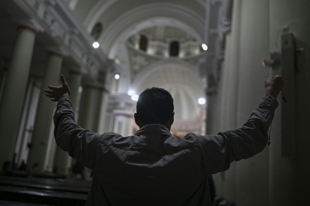A man prays at the Chiclayo's cathedral, northern Peru on May 8, 2025.