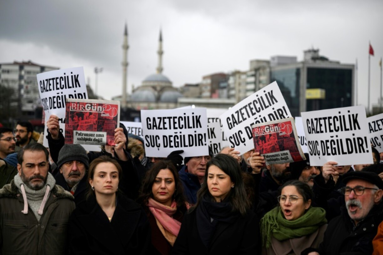 Demonstrators gathered outside the Istanbul courthouse where the BirGun journalists were taking with banners reading: 'Journalism is not a crime'