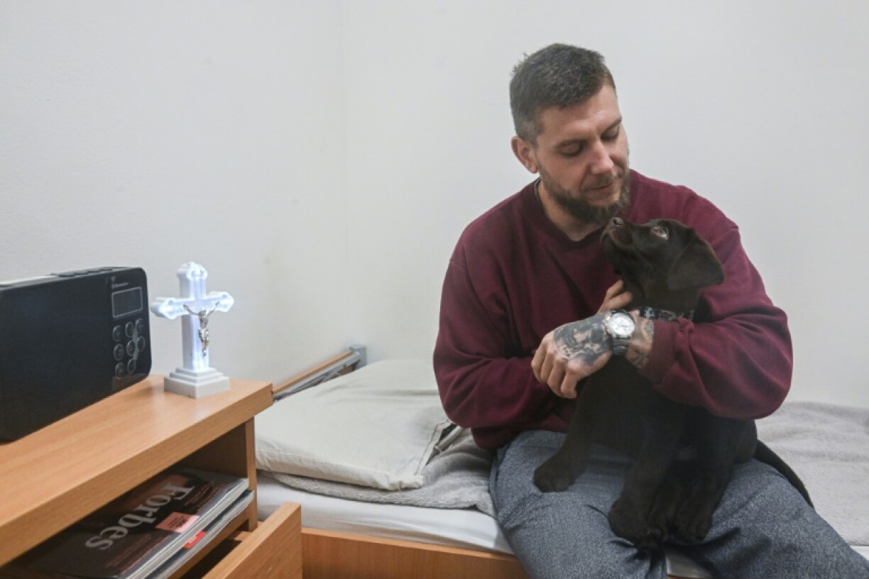 Prisoner Marek Kolar says caring for puppy Zirkon makes him 'happy'
