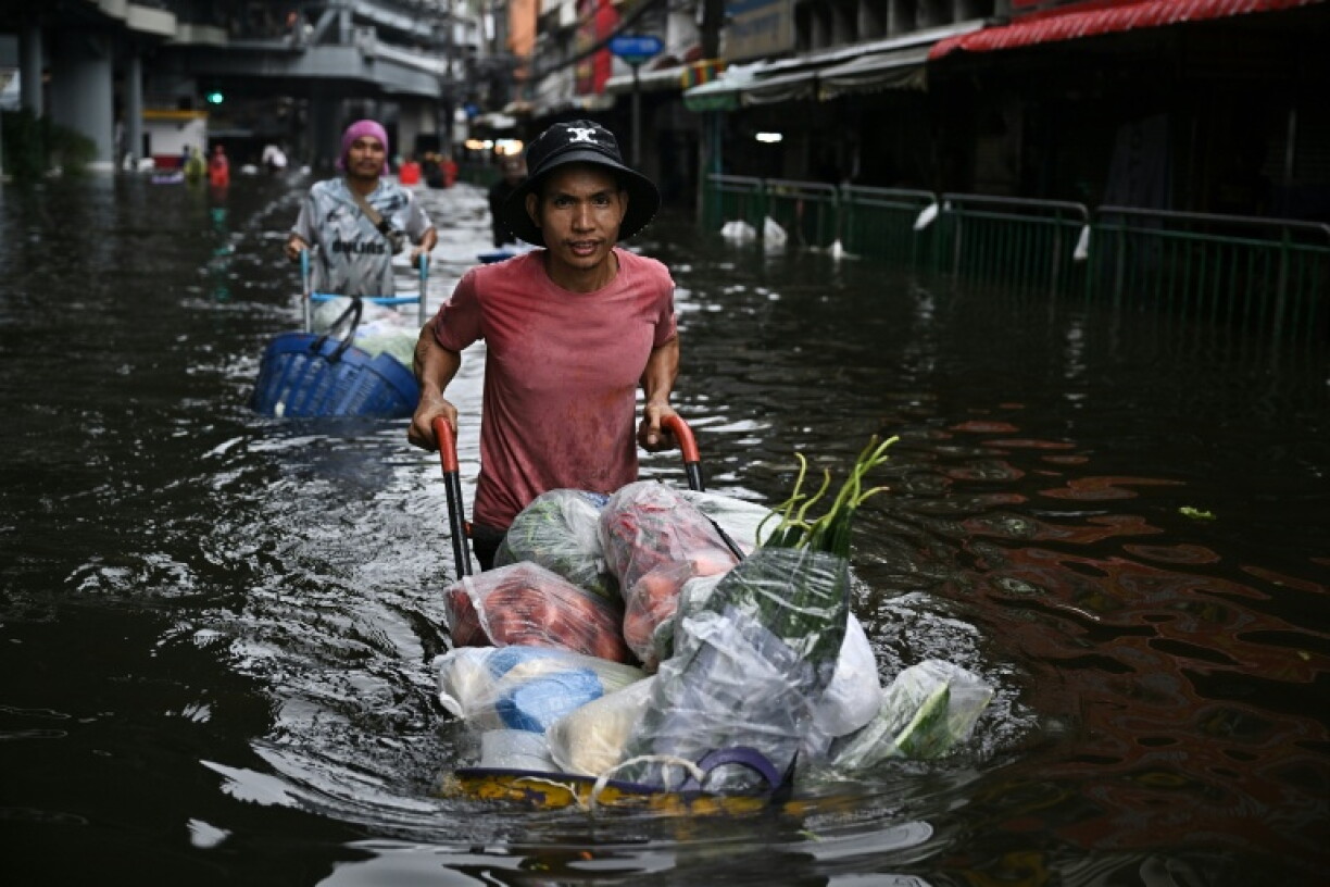 Parts of Bangkok remain under water two days after authorities declared a city-wide flood disaster