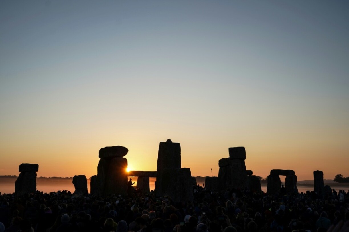 The sun rises at Stonehenge, near Amesbury, in southern England
