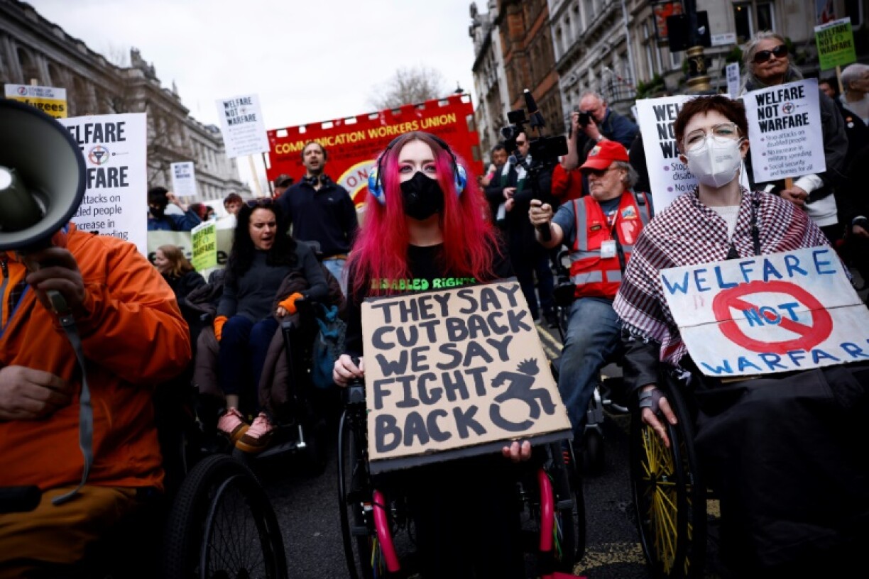 Protestors gathered outside Downing Street after the UK cut welfare spending