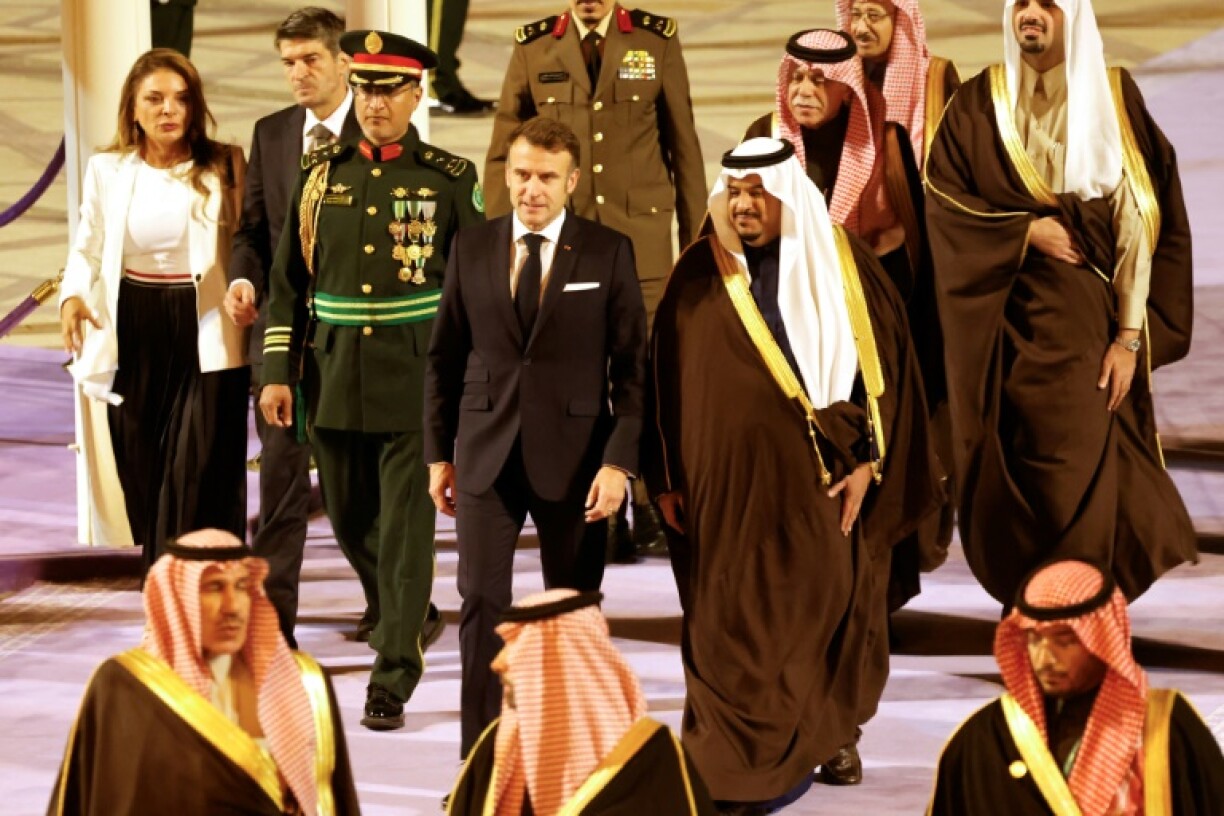 French President Emmanuel Macron (C-L) was received by Crown Prince Mohammed bin Abdulrahman bin Abdulaziz (C-R) in Riyadh