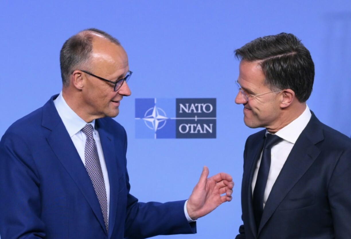 German Chancellor Friedrich Merz, left, with NATO chief Mark Rutte at the alliance headquarters on Friday