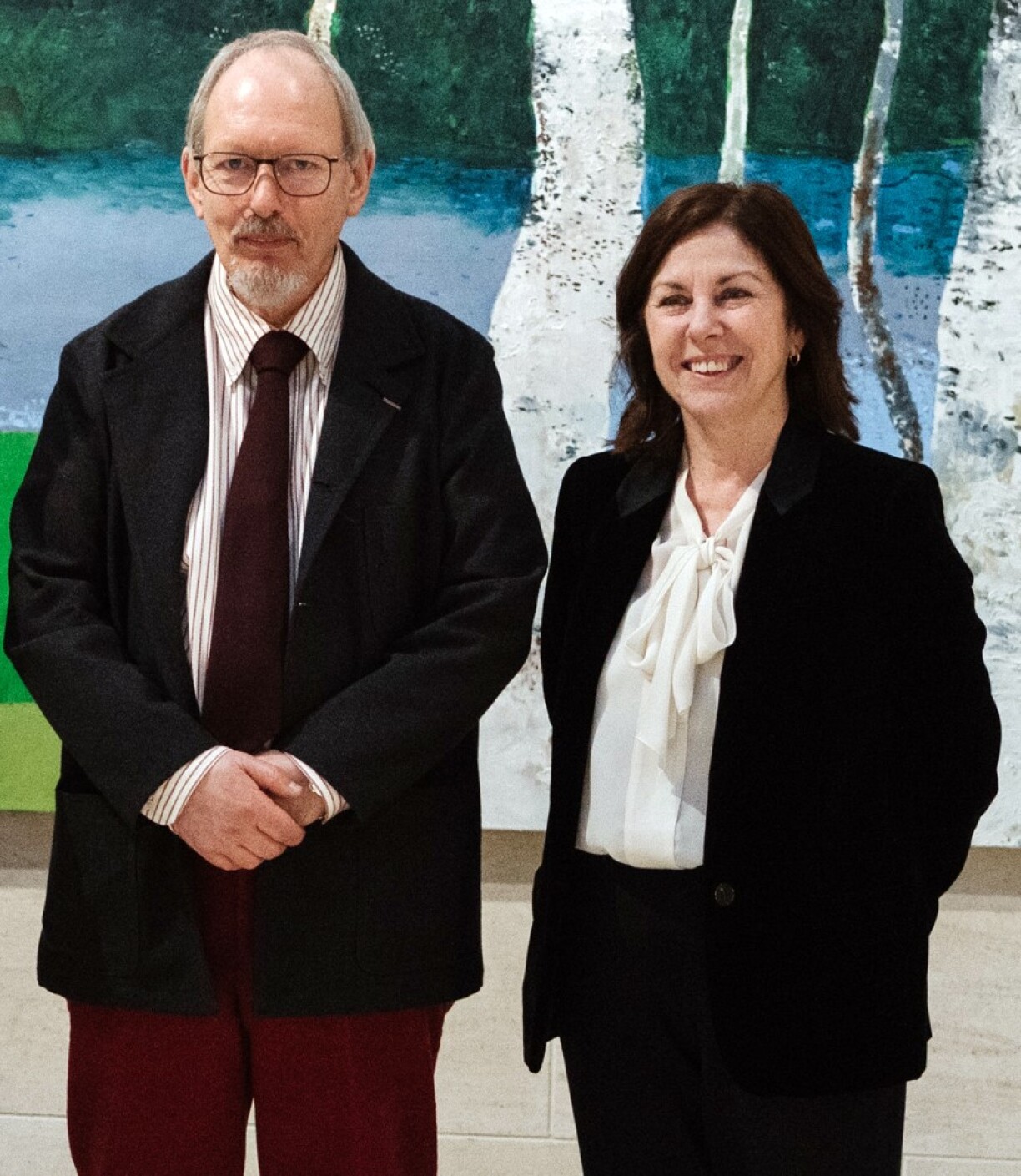 Jean-Marie Biwer and Suzanne Cotter in front of the Birch Tree Painting at the Cafeteria at Mudam.