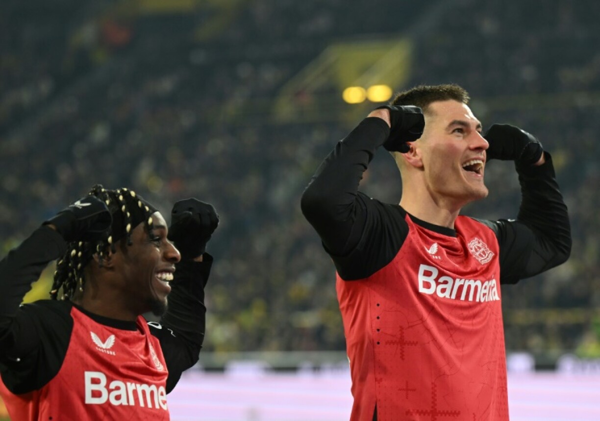 Bayer Leverkusen's Czech forward Patrik Schick (R) scored a first-half brace in Friday's 3-2 win at Borussia Dortmund