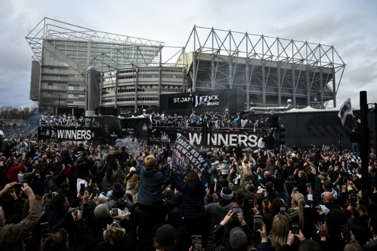 Newcastle players paraded a first domestic trophy in 70 years through the city