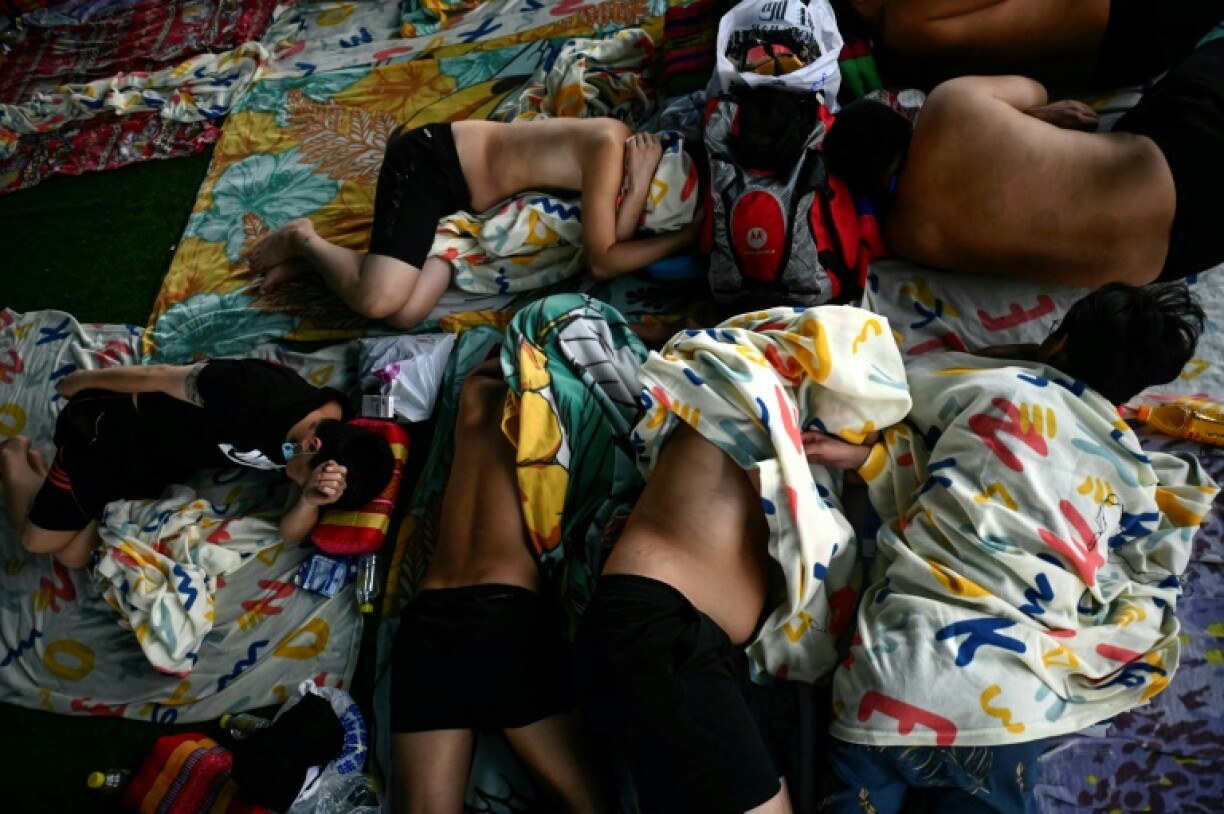 Victims held at a squalid, overcrowded detention camp near the Thai border are begging to leave