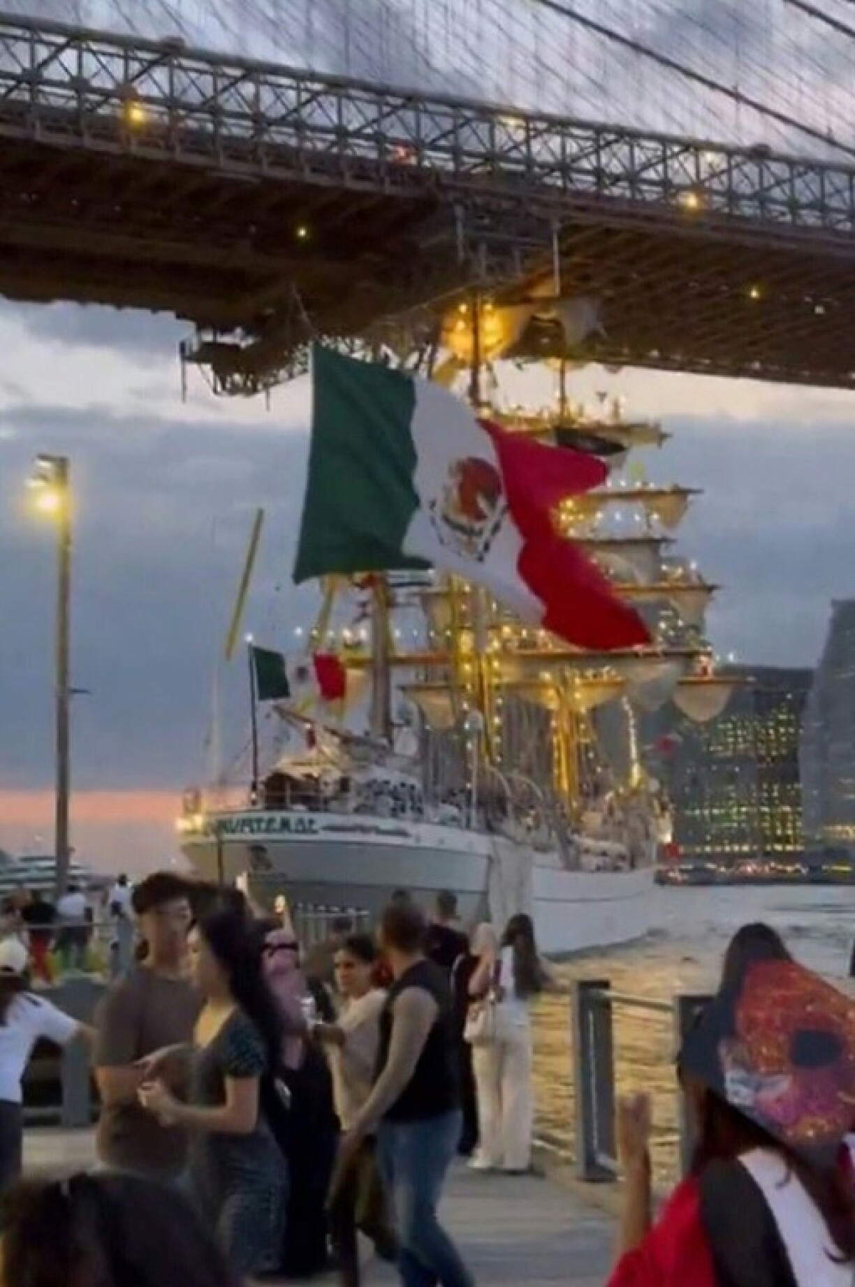 Bystanders described panic and screaming onboard the ship, with sailors hanging from the masts