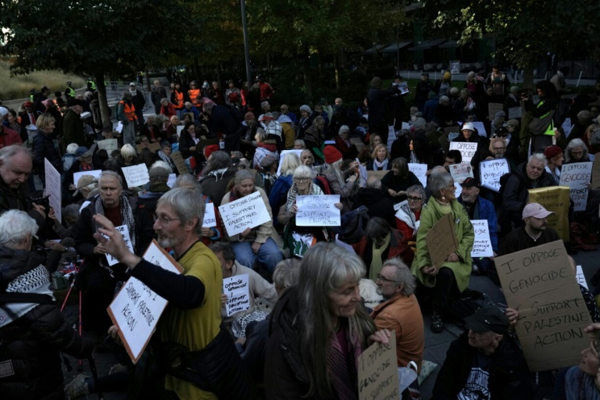 People stage a protest Saturday in support of the proscribed group Palestine Action outside the US Embassy in London