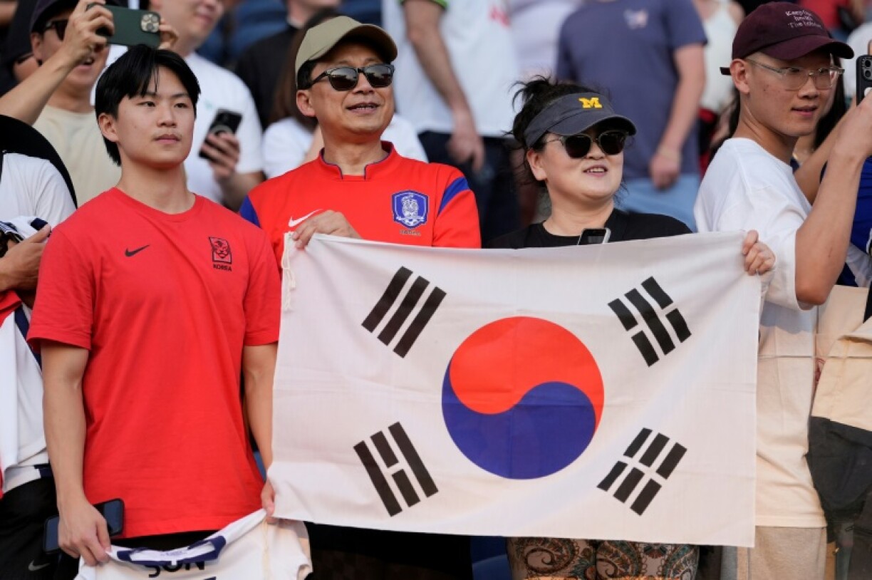 Fans hold the South Korean flag during the match between Chicago Fire FC and Los Angeles FC in Chicago in anticipation of Son Heung-min's MLS debut for LAFC
