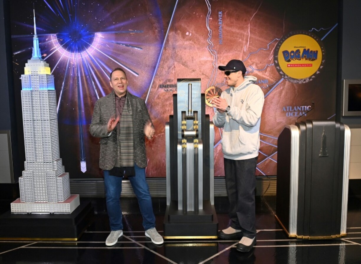 Pete Davidson (R) who voices the titular character in the animated movie 'Dog Man,' visits The Empire State Building with Dav Pilkey to celebrate the film's premier