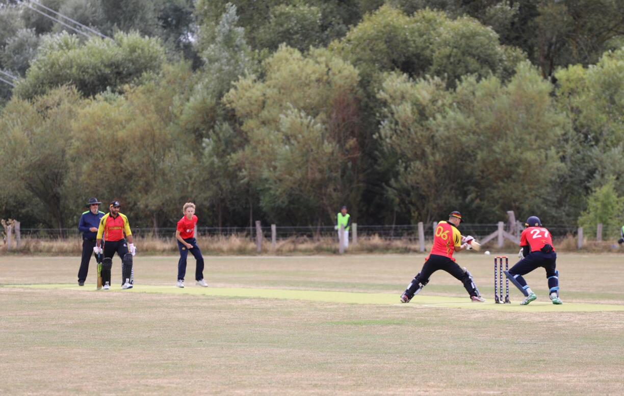 Luxembourg's Marcus Cope bowling against Belgium.