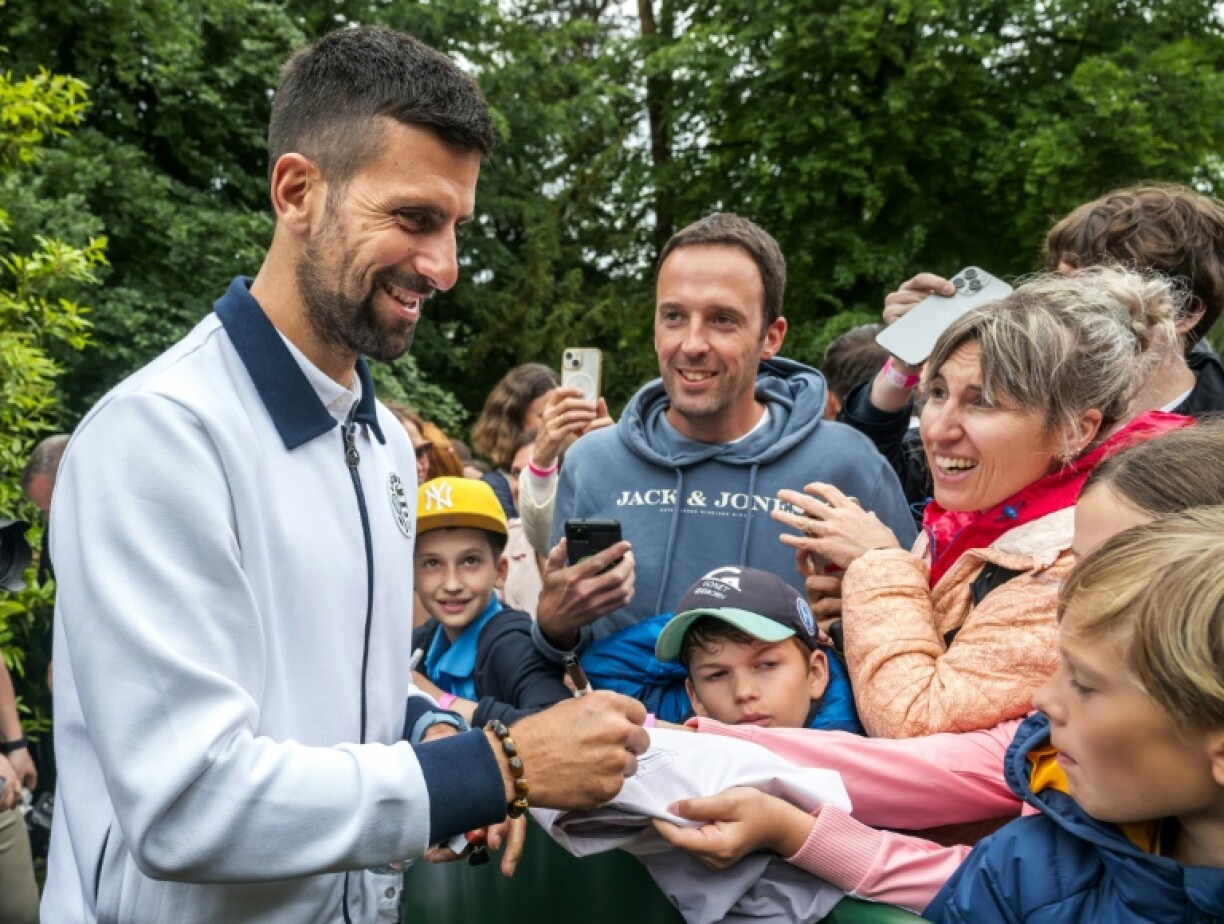 Serbia's Novak Djokovic meets fans ahead of his bid for a first win on clay in Geneva this week as the French Open looms