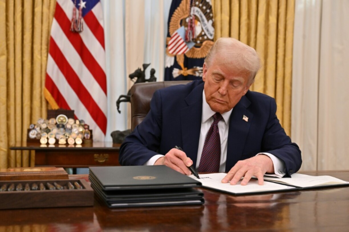 US President Donald Trump signs an executive order to declassify files on the assassinations of former president John F. Kennedy, former Attorney General Robert F. Kennedy and civil rights leader Martin Luther King Jr.